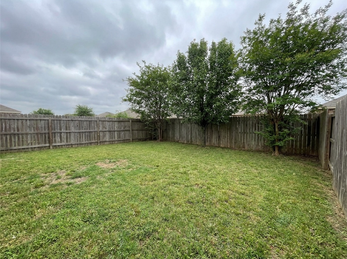 Empty backyard corner before a detached ADU was built